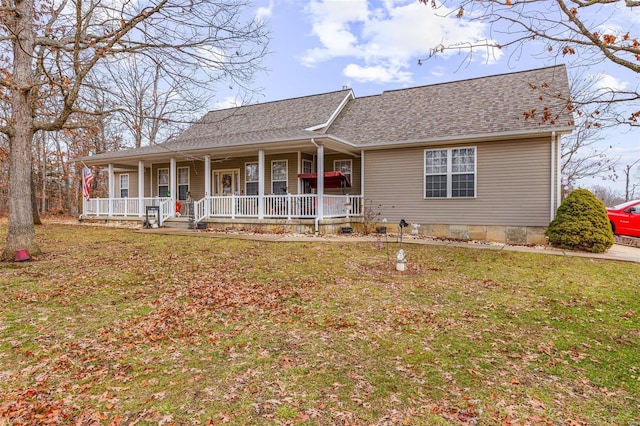 view of front facade featuring a front yard and covered porch