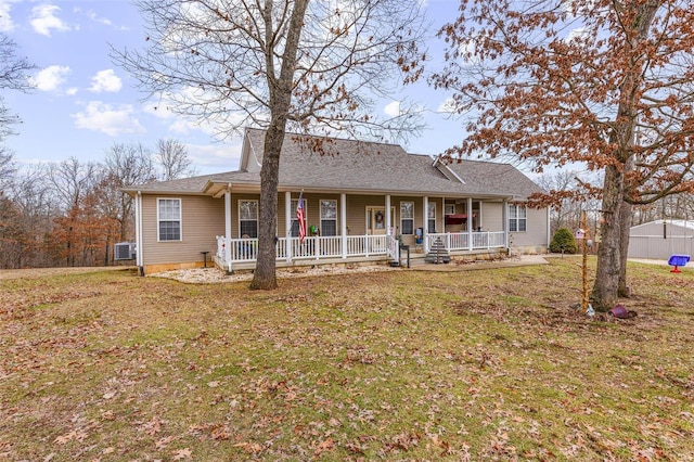 ranch-style home featuring a porch and a front yard