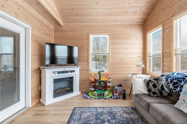 living room featuring wood ceiling, lofted ceiling, plenty of natural light, and light hardwood / wood-style floors