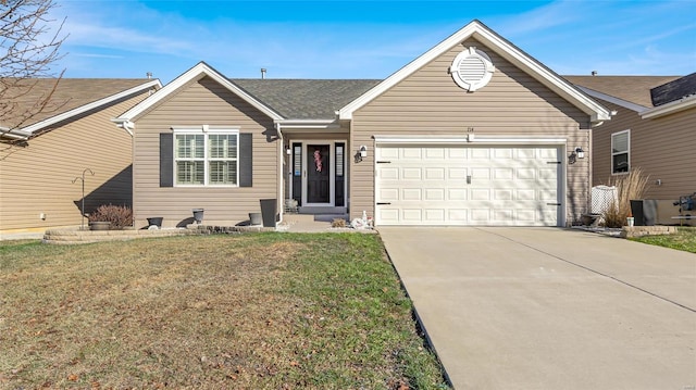 ranch-style home featuring a garage and a front lawn