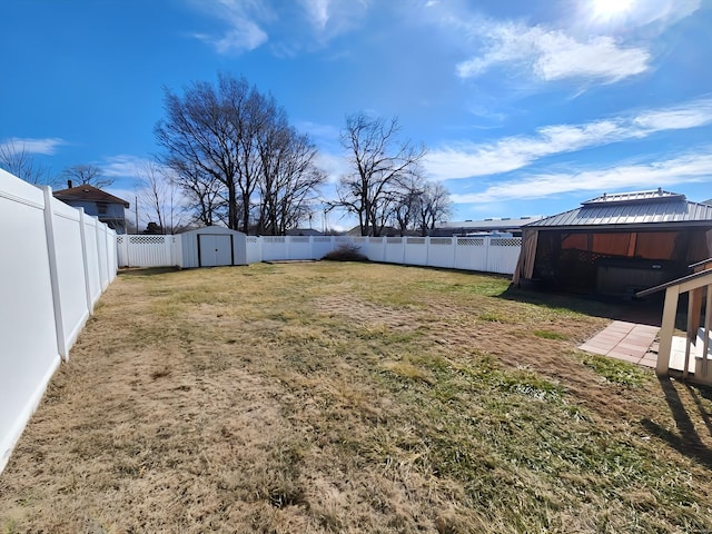 view of yard featuring a gazebo and a storage unit