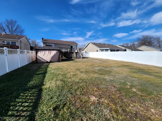 view of yard with a wooden deck and a gazebo