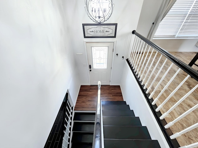 stairway featuring hardwood / wood-style floors