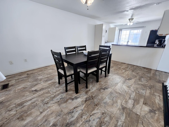 dining area featuring ceiling fan