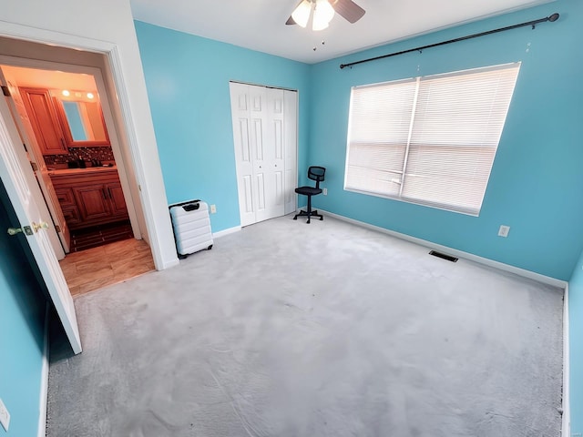 unfurnished bedroom featuring a closet and ceiling fan