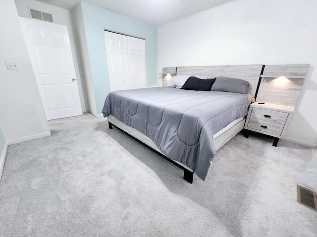 carpeted bedroom with a closet