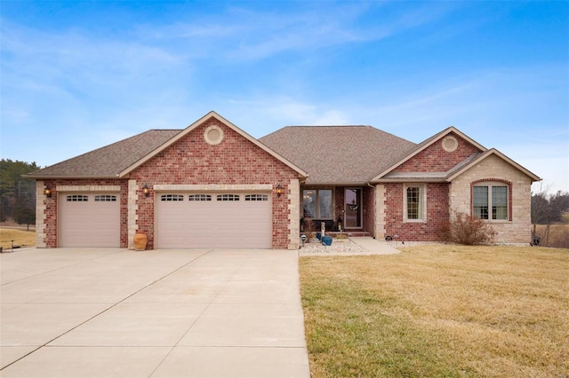 view of front of house featuring a garage and a front yard