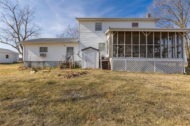 back of house featuring a yard and a sunroom