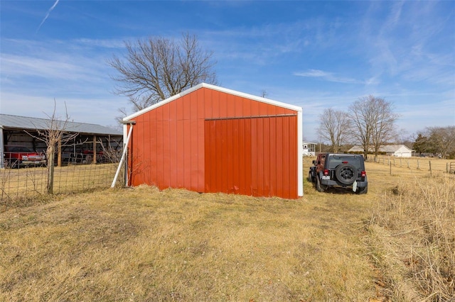 view of outdoor structure featuring a lawn