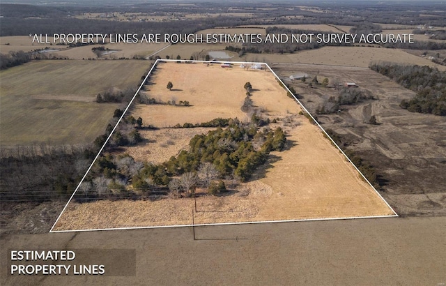 birds eye view of property with a rural view