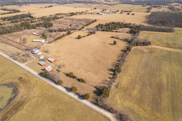 birds eye view of property featuring a rural view