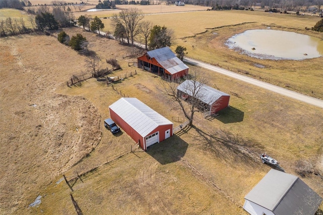 bird's eye view featuring a water view and a rural view