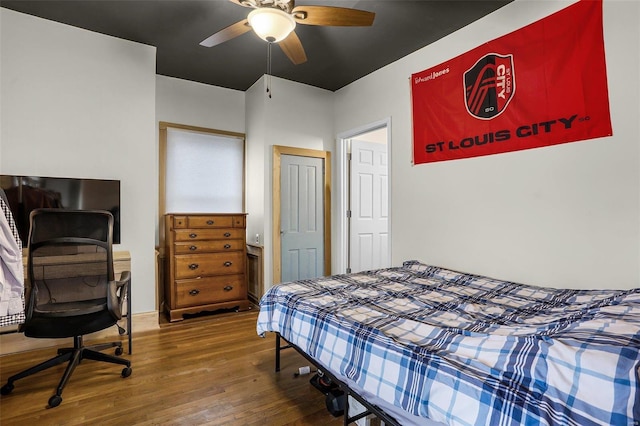 bedroom with ceiling fan and hardwood / wood-style floors