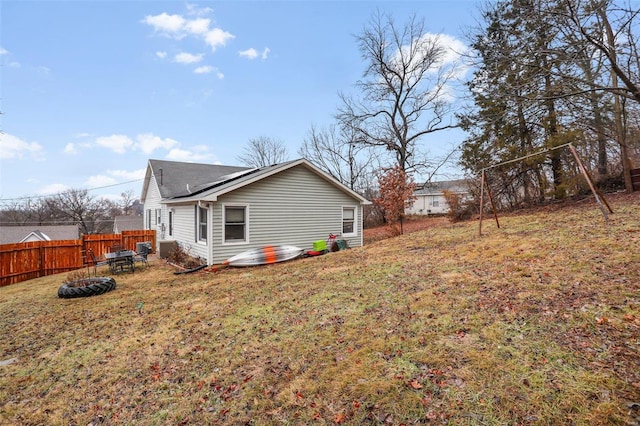 view of home's exterior with a lawn