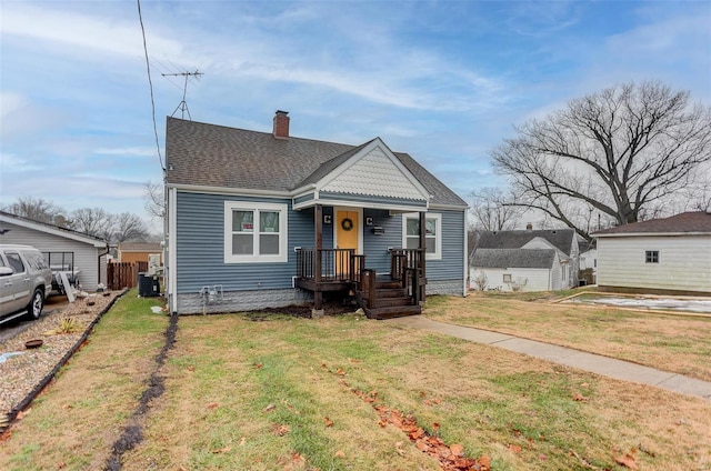 bungalow-style house featuring a front yard