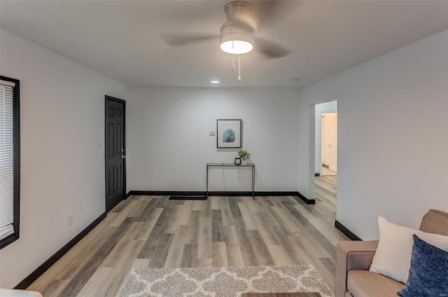 empty room featuring ceiling fan and light wood-type flooring