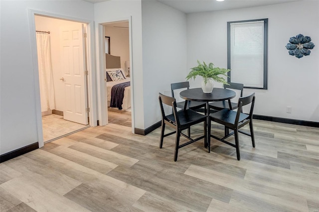 dining room with light wood-type flooring