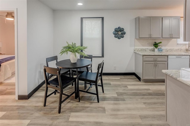 dining area featuring light wood-type flooring