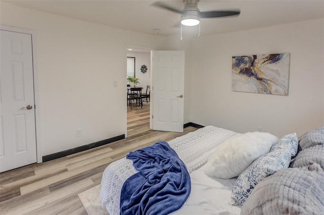 bedroom with ceiling fan and light wood-type flooring