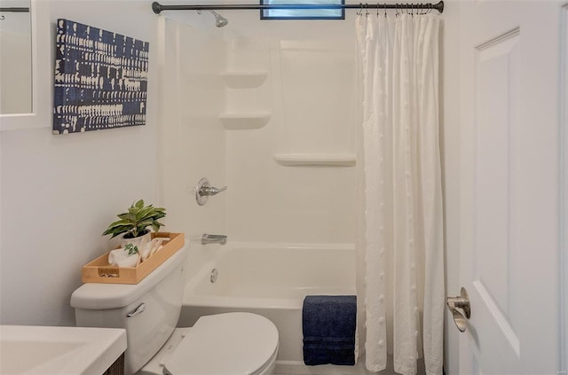 bathroom featuring shower / bath combination with curtain and toilet