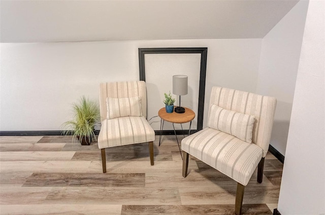 living area with hardwood / wood-style flooring