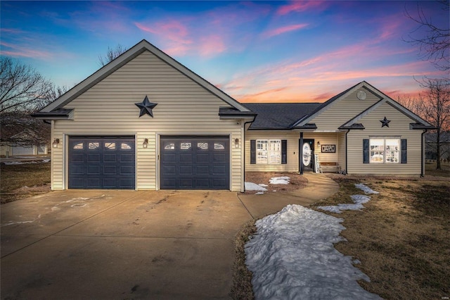 view of front of house with a garage and concrete driveway