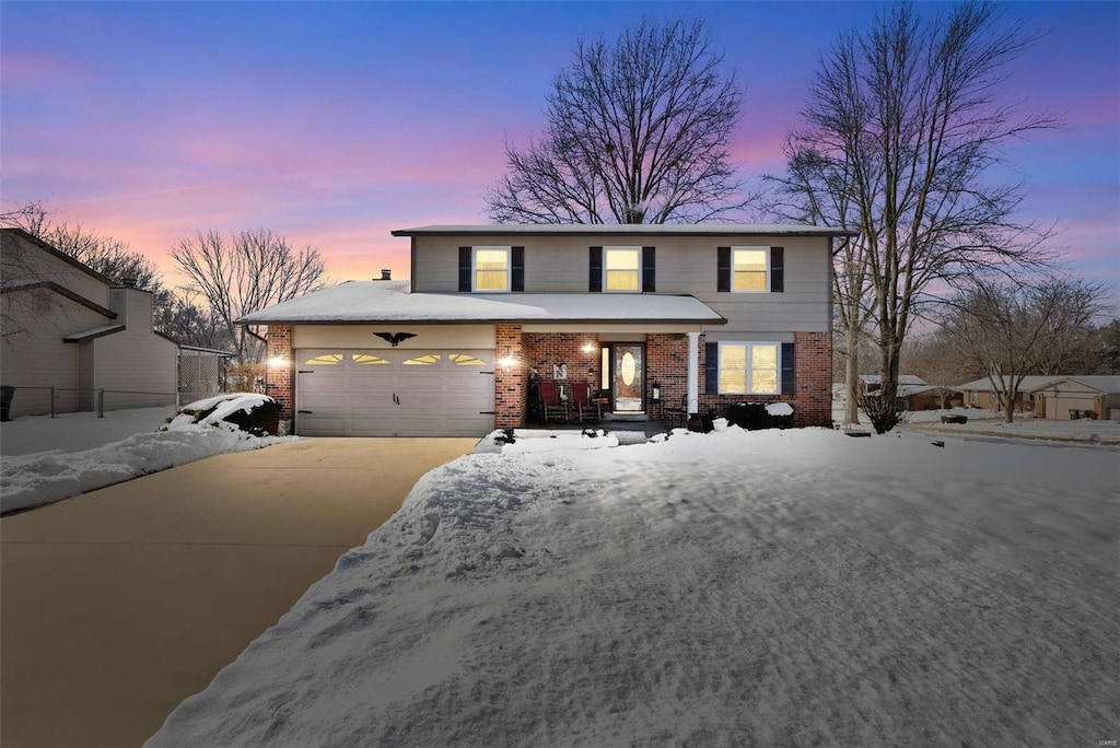 front facade with a garage