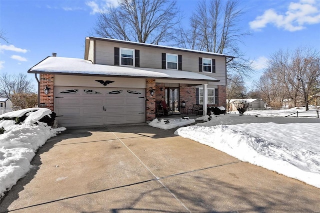 view of property with a garage and a porch