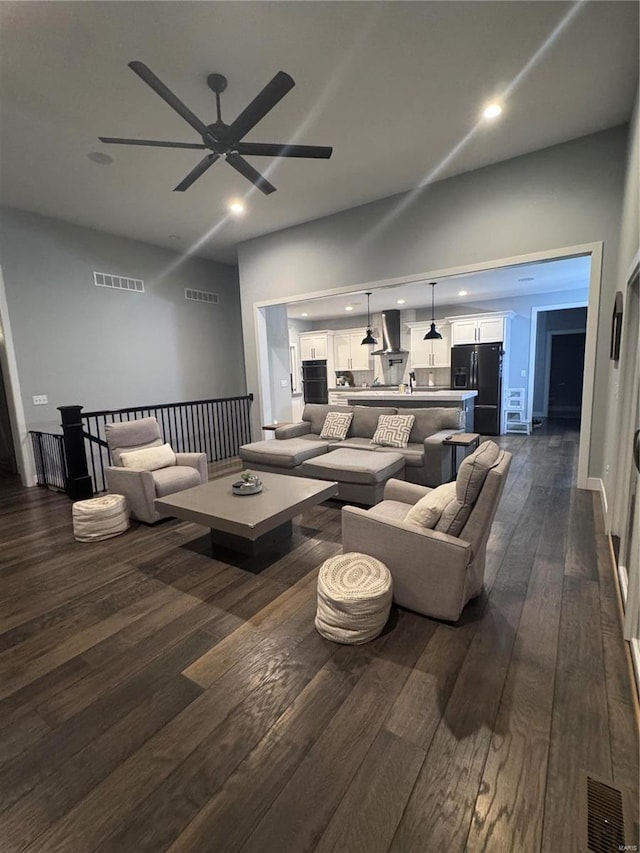 living room with dark hardwood / wood-style flooring