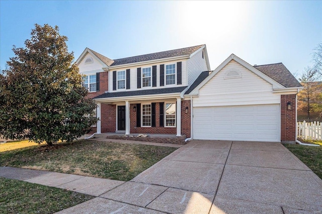 traditional-style house with brick siding, concrete driveway, a garage, and fence