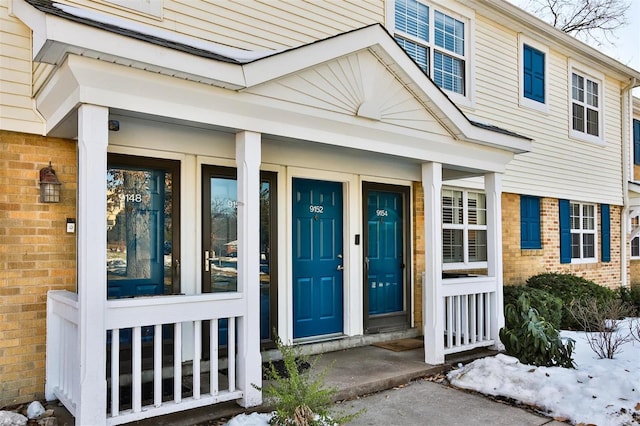 view of snow covered property entrance