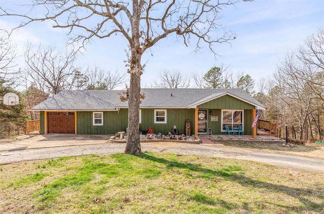 ranch-style home featuring a garage and a front yard