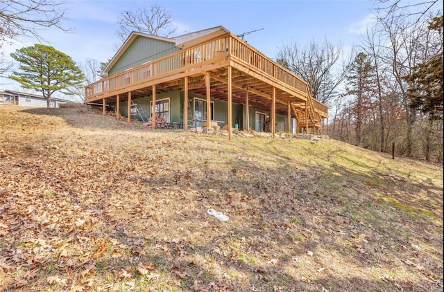 back of house featuring a deck