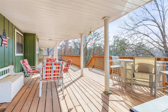 wooden deck featuring exterior bar