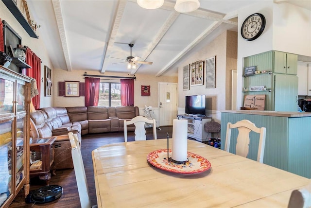 dining area featuring wood-type flooring, vaulted ceiling with beams, and ceiling fan