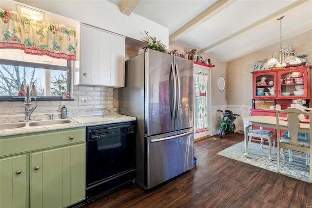 kitchen featuring sink, stainless steel fridge, dishwasher, vaulted ceiling with beams, and dark hardwood / wood-style floors