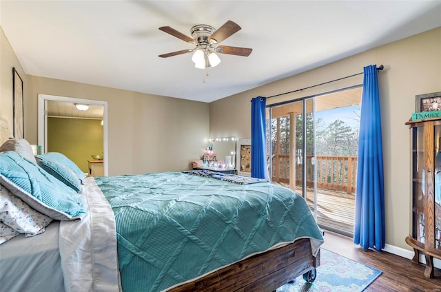 bedroom featuring dark hardwood / wood-style floors, access to exterior, ceiling fan, and ensuite bath