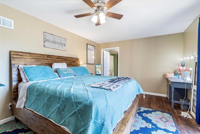 bedroom with dark wood-type flooring and ceiling fan