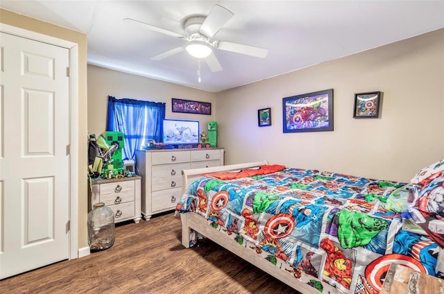 bedroom with ceiling fan and hardwood / wood-style floors