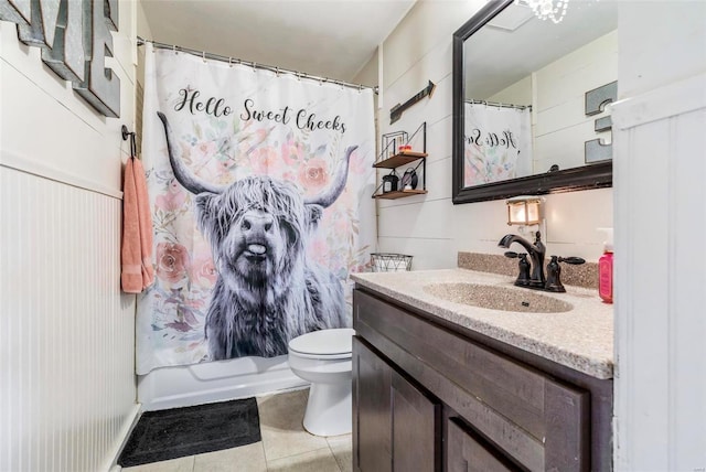 full bathroom featuring vanity, tile patterned floors, shower / bath combination with curtain, and toilet