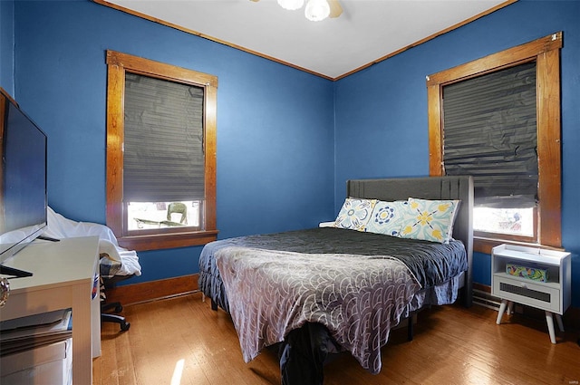 bedroom with hardwood / wood-style flooring