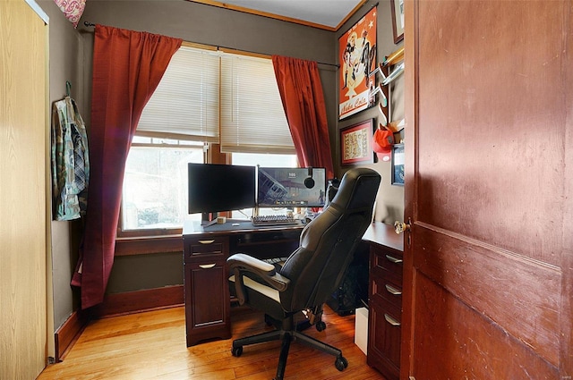 office with light hardwood / wood-style flooring