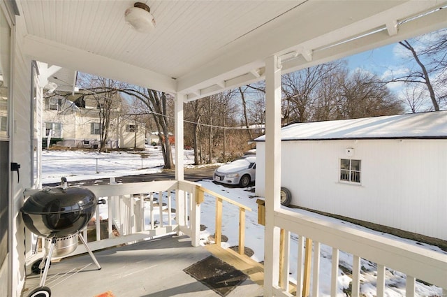 snow covered patio featuring grilling area