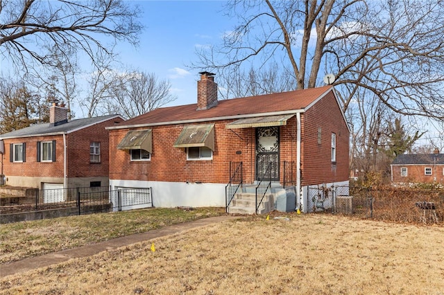 back of house with a yard