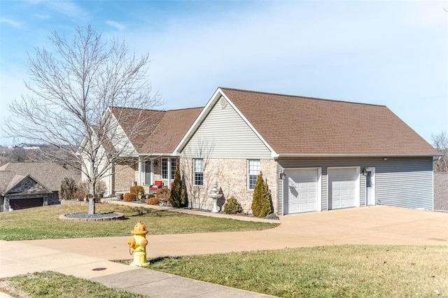 view of front facade with a garage and a front lawn