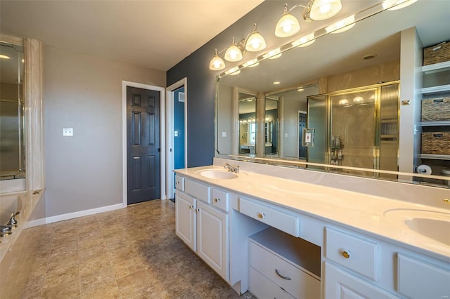 bathroom with vanity and shower with separate bathtub