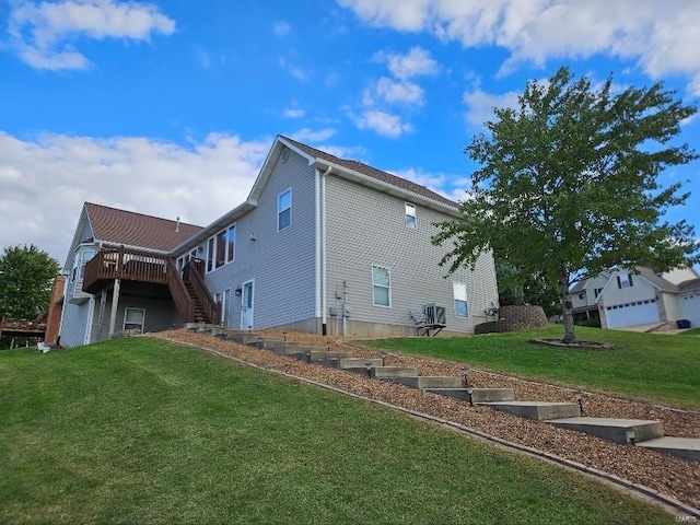 view of property exterior featuring a lawn and a deck