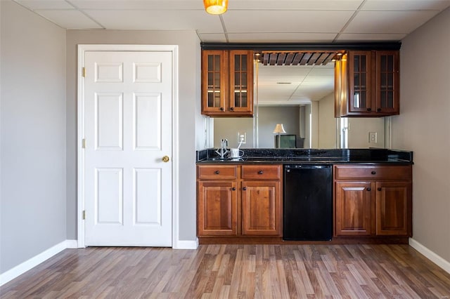 kitchen featuring a drop ceiling and hardwood / wood-style floors