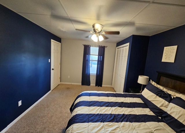 bedroom featuring a closet, ceiling fan, and carpet flooring