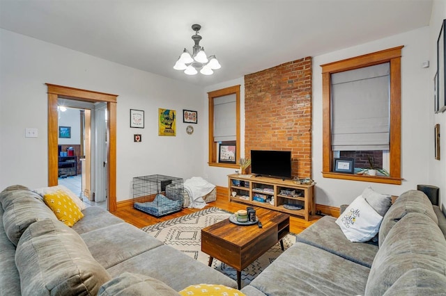 living room with wood-type flooring and a chandelier